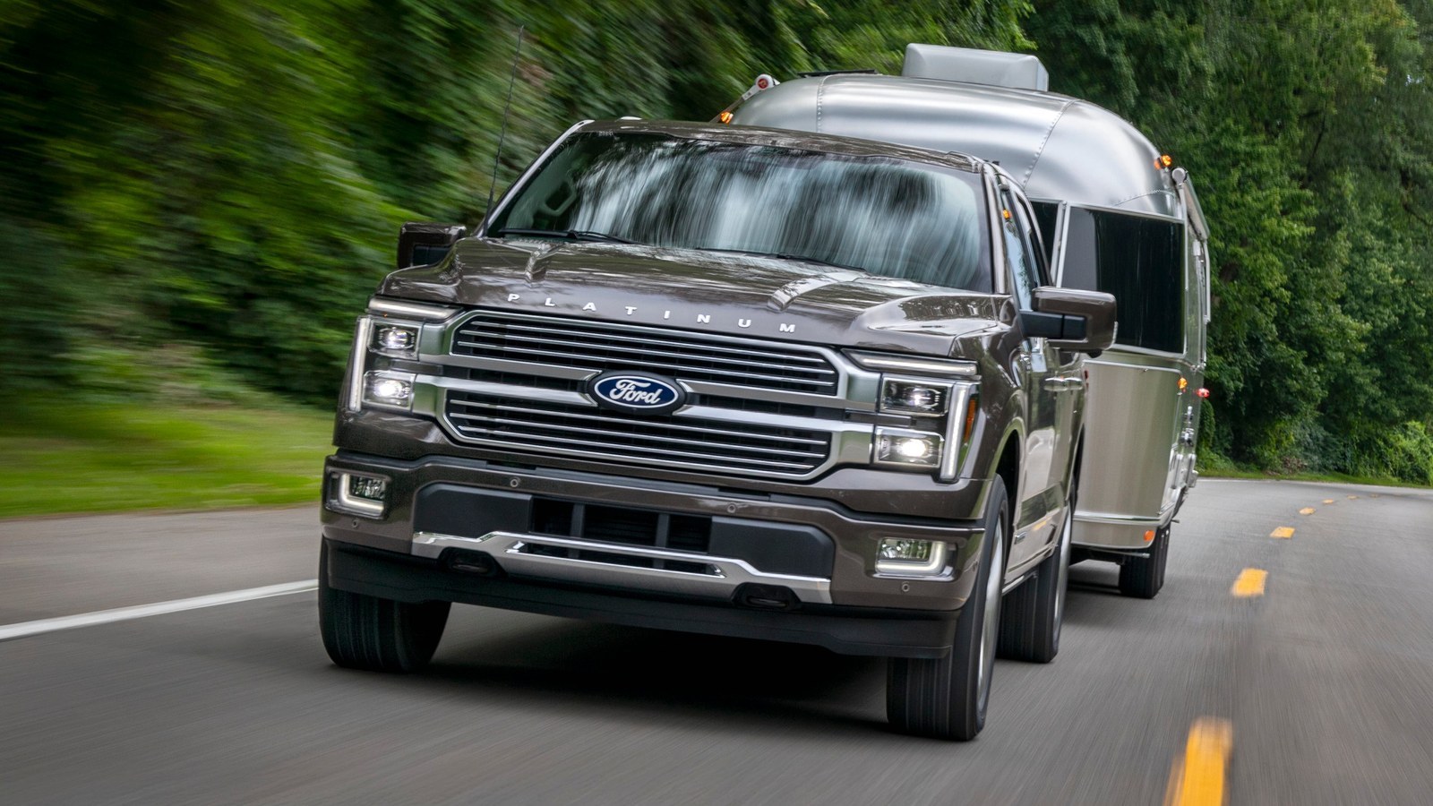 2026 Ford F-150 Platinum towing a travel trailer