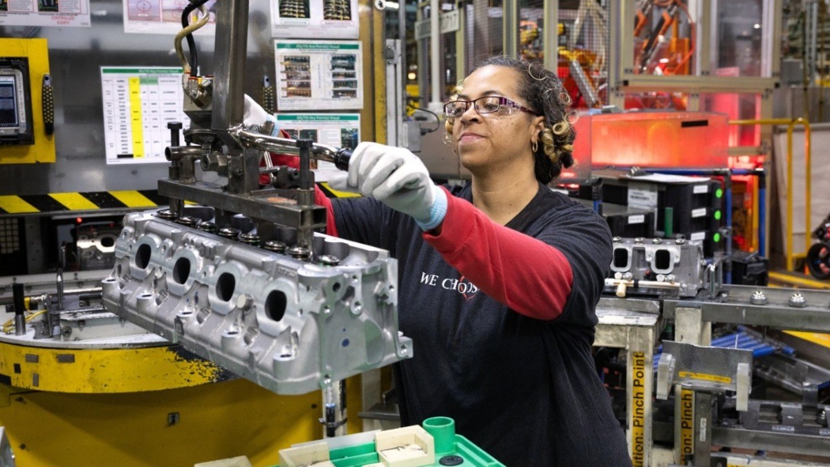 A worker at GM's Tonawanda Propulsion plant in Buffalo handles an aluminum V8 cylinder head on the assembly line
