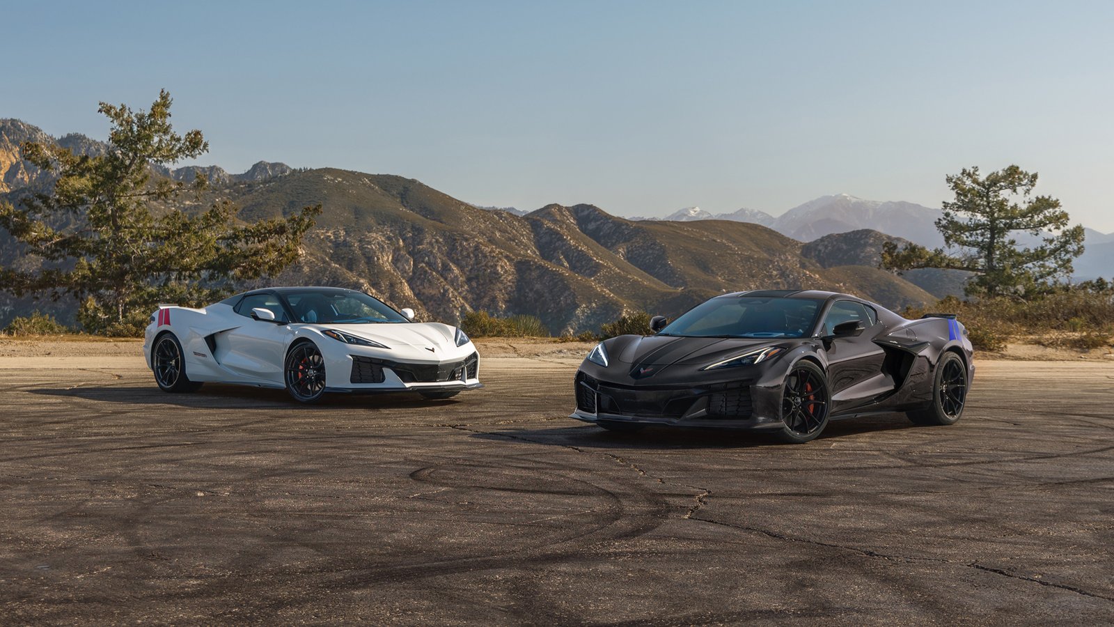 2027 Chevrolet Corvette Grand Sport Launch Edition in Arctic White and Grand Sport X in Pitch Gray Metallic parked side by side