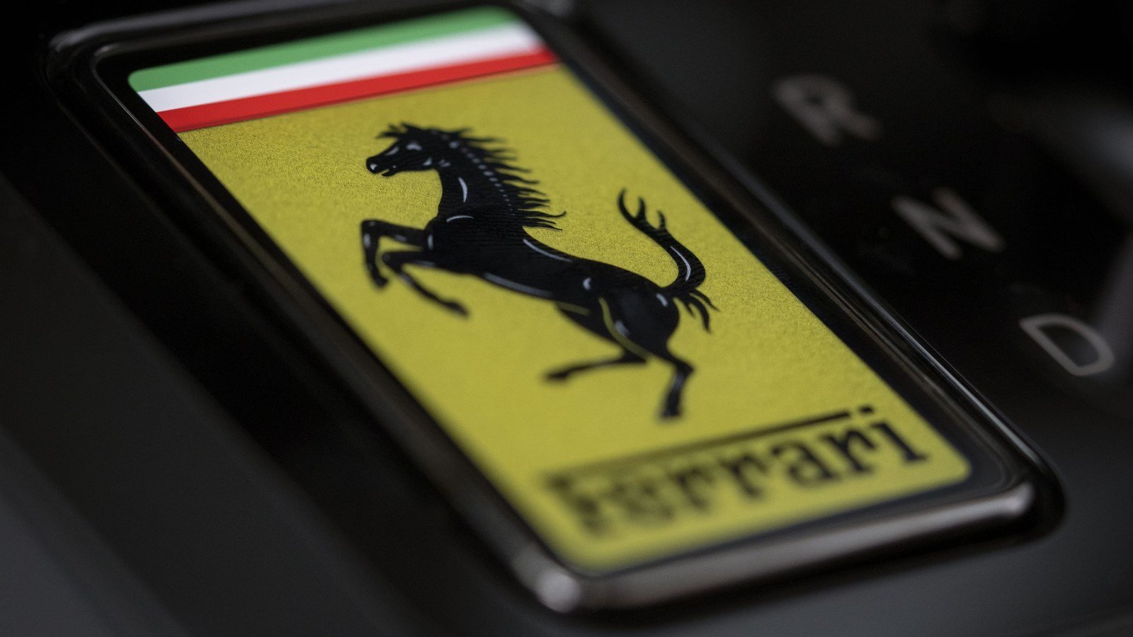 Close-up of the prancing horse Ferrari shield on the Luce's center console
