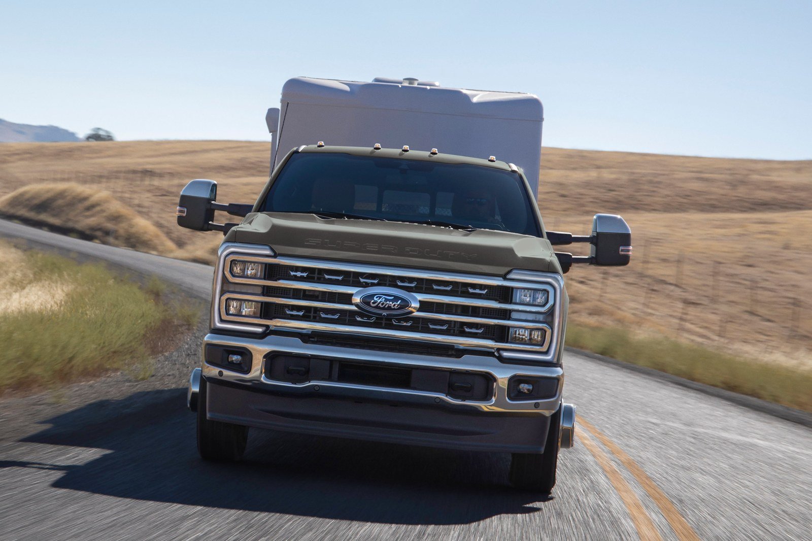 Ford Super Duty pickup towing a camper