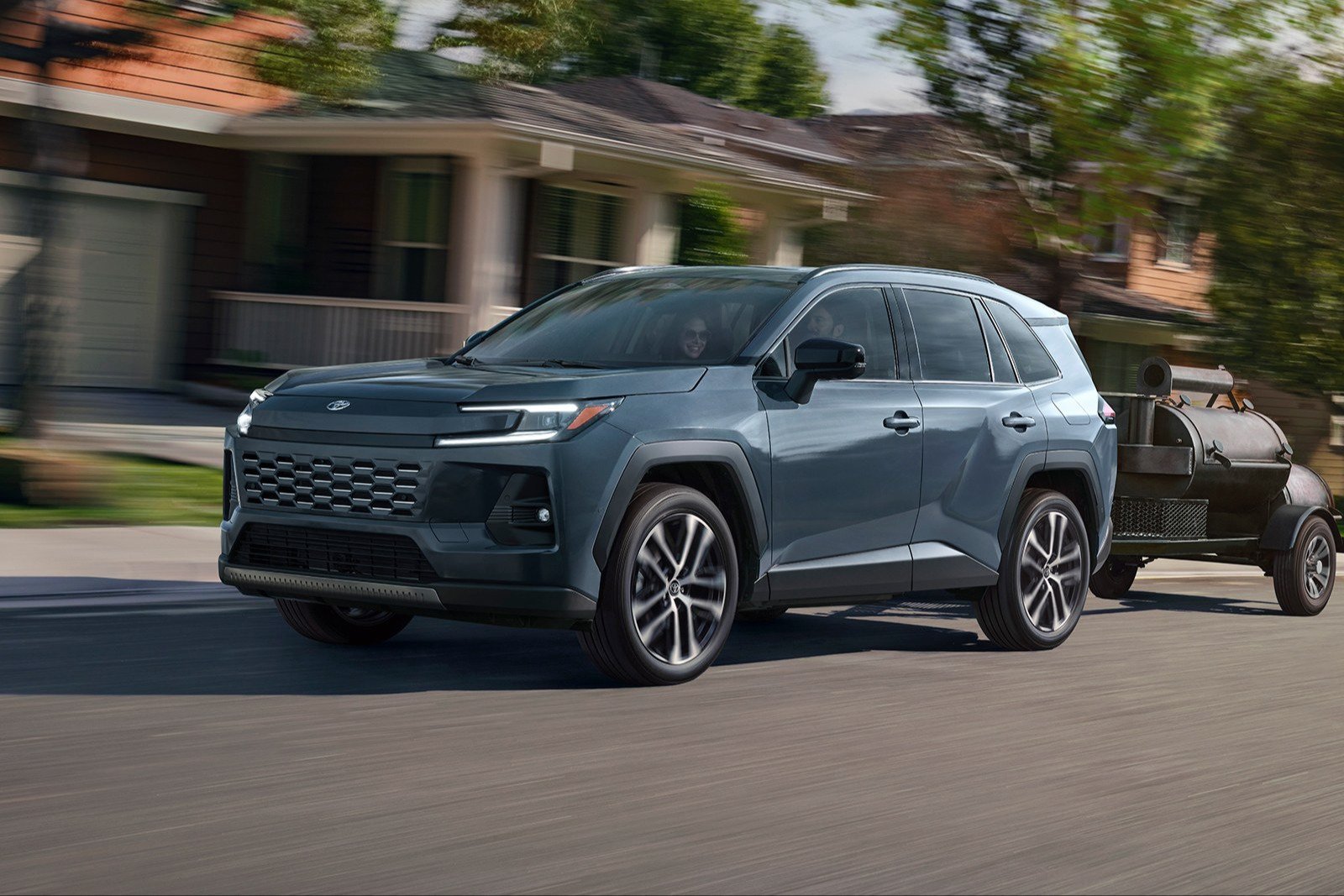 2026 Toyota RAV4 Limited driving on a suburban street