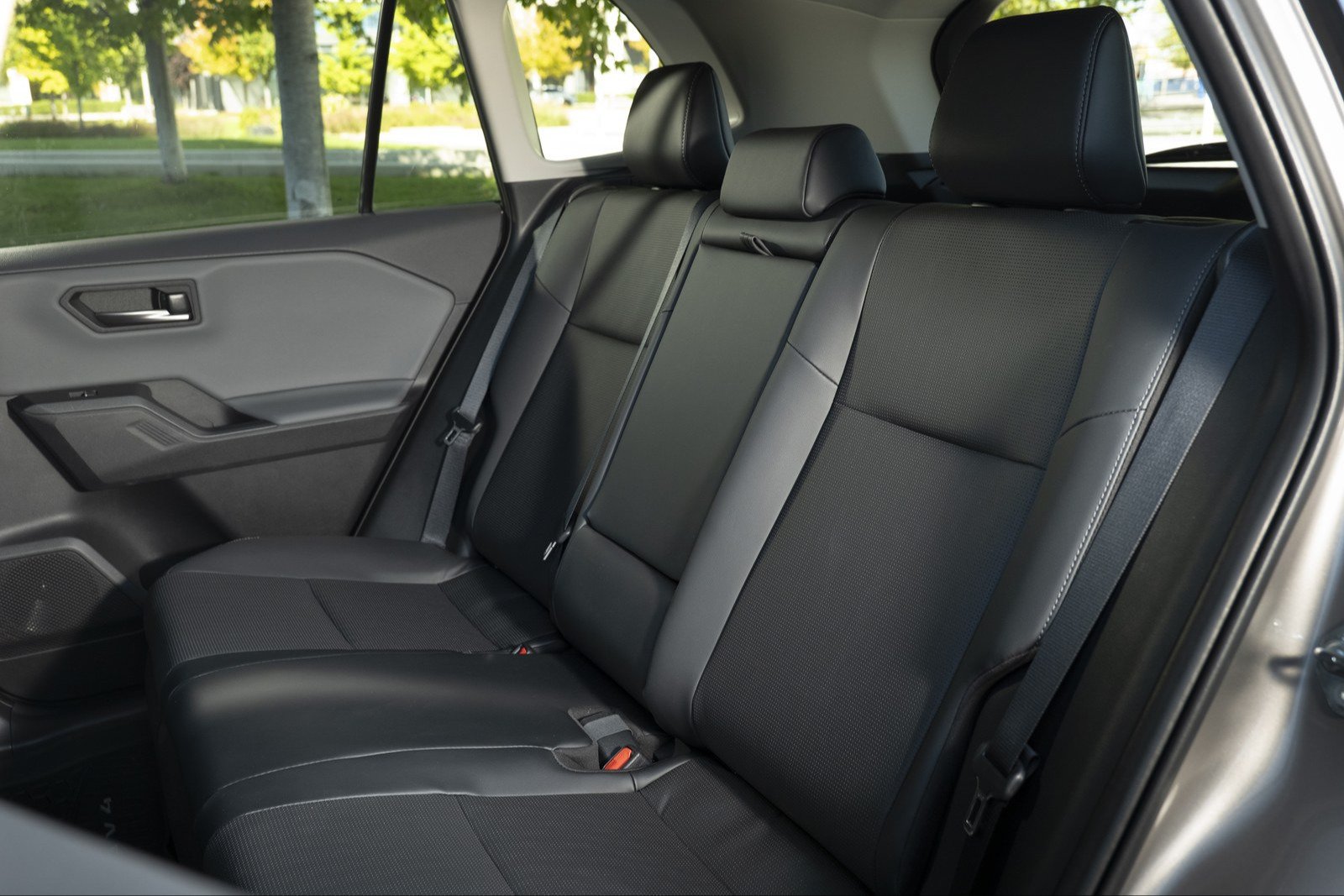 Second-row bench of the 2026 Toyota RAV4 with outboard seat belts and buckles