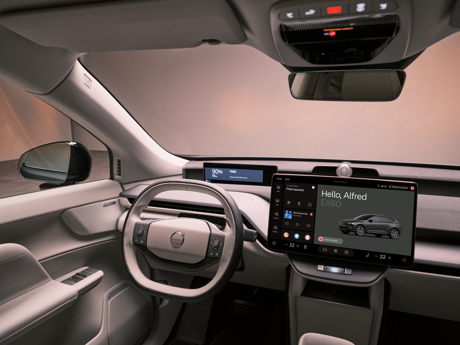 Volvo EX60 cabin with yoke-style steering wheel and center touchscreen